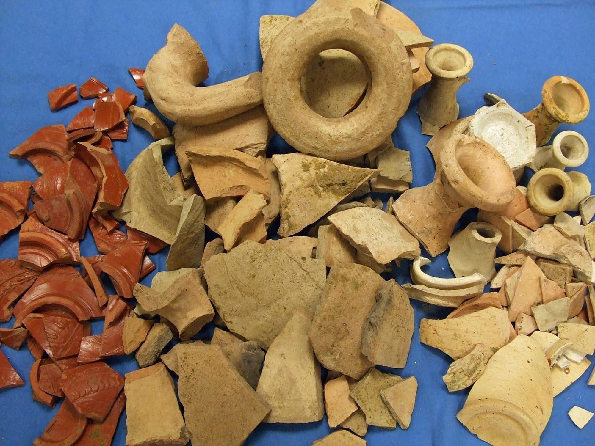 Broken pottery from a refuse pit behind a Roman shop near St Nicholas Circle. The assemblage included bowls, amphorae, jars and flagons suitable for storing and displaying food - University of Leicester Archaeological Services