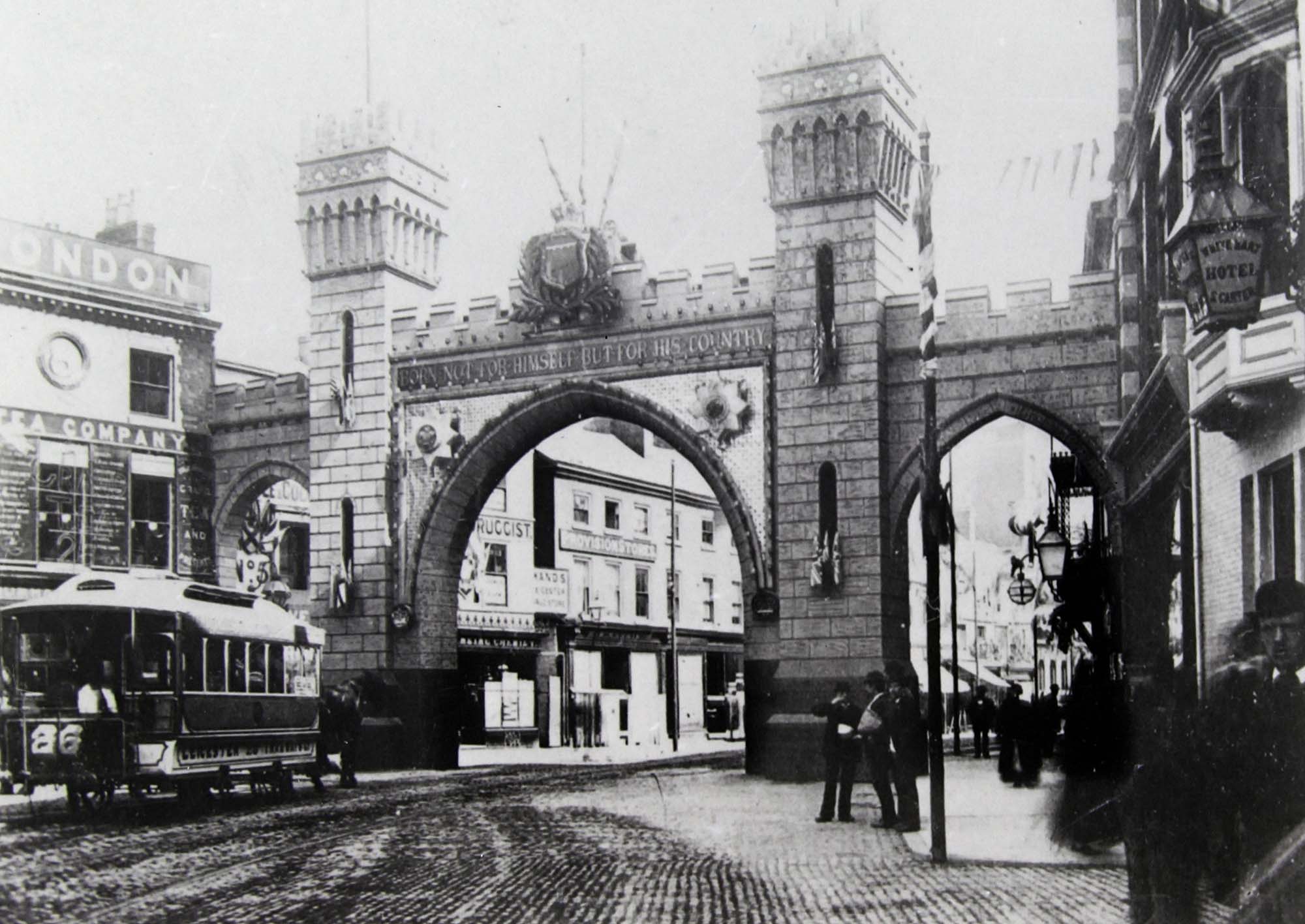 A temporary arch built for the royal visit of the Price of Wales in 1882. This one was at the top of Belgrave Gate near the Clock Tower but there were more around the city - Leicestershire Record Office