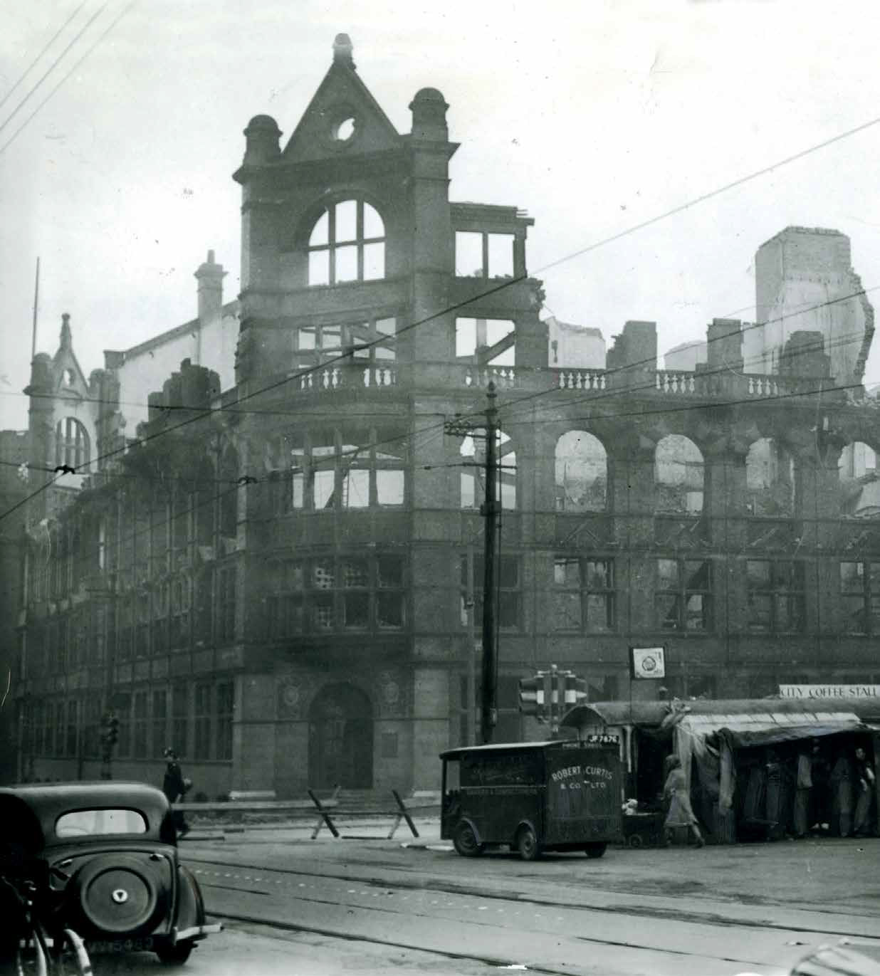 The ruins of the Freeman, Hardy and Willis building, with the fondly remembered City Coffee Stall in front - Austin J. Ruddy
