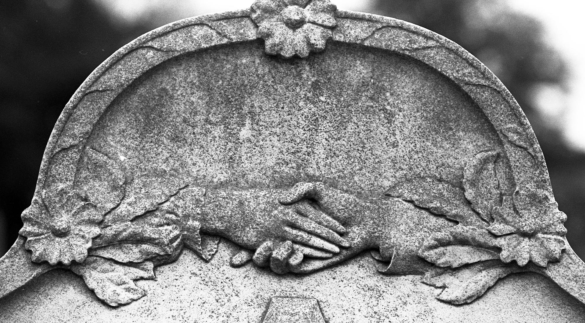 Detail of stonework on a gravestone at Welford Road Cemetery -