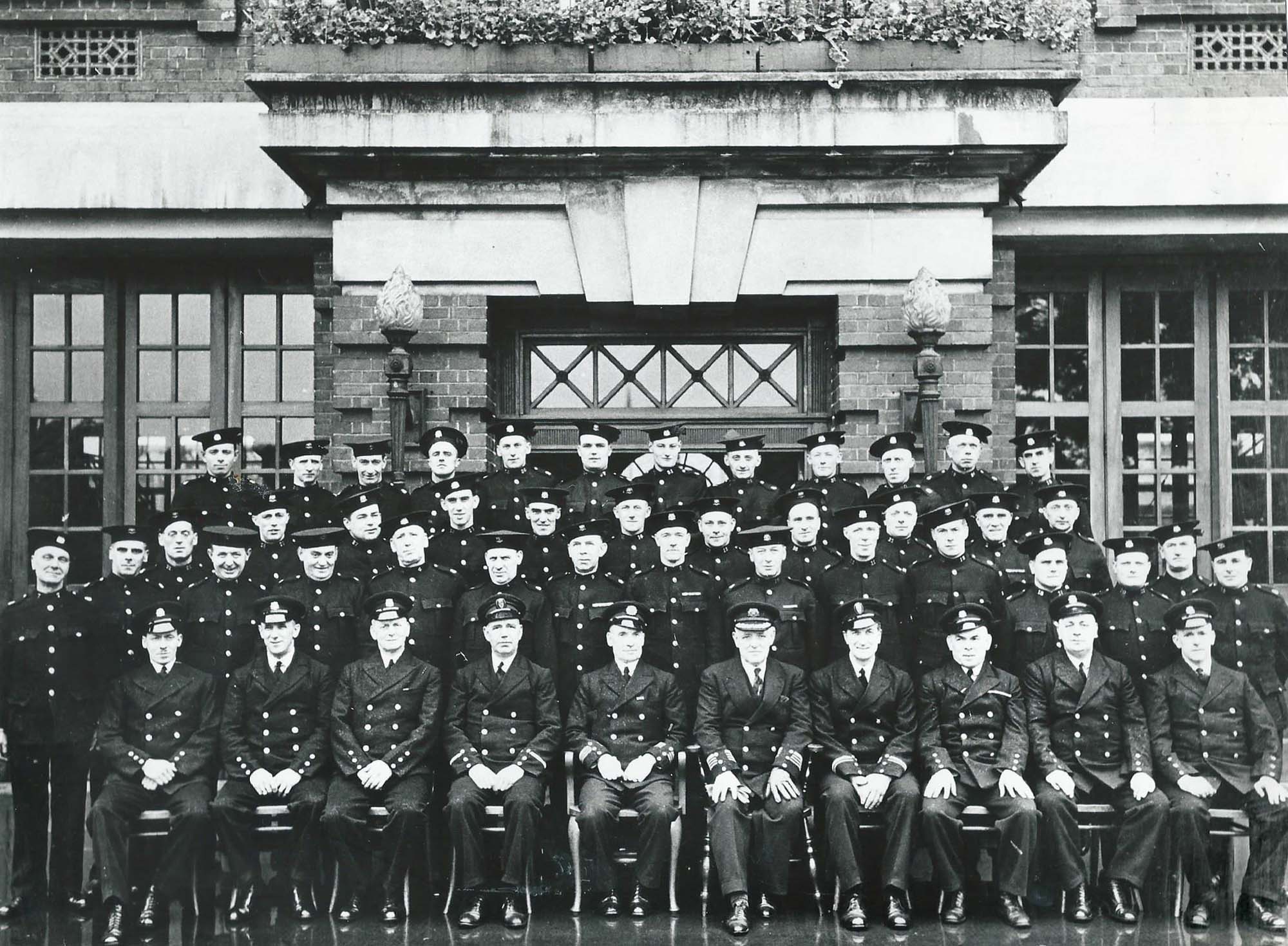 Fireman pose for a photo around 1936, possibly at a retirement get together - Malc Tovey