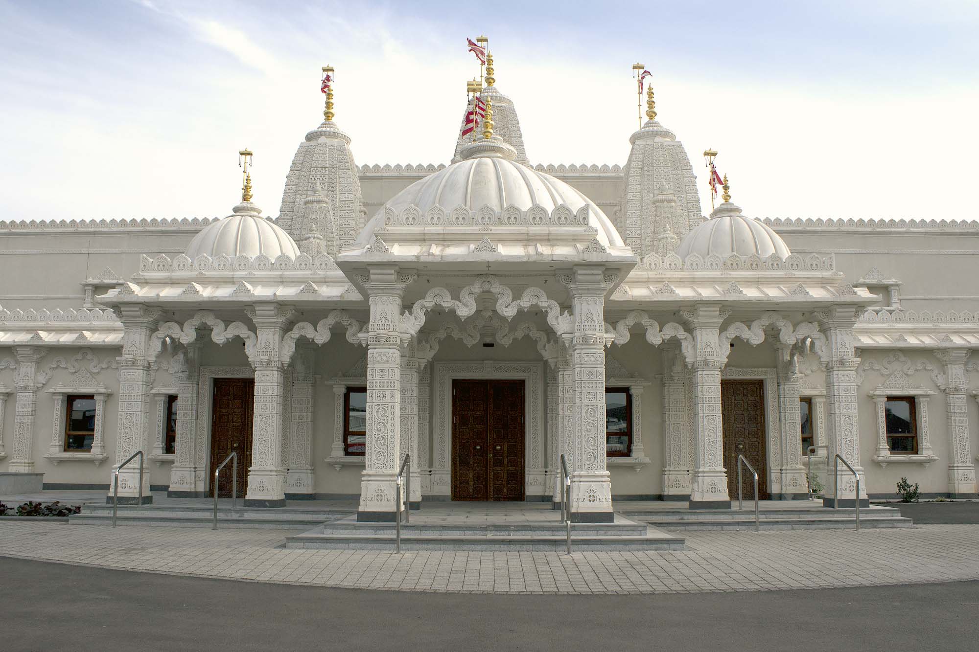 The front entrance has white limestone that was exquisitely carved in India - 