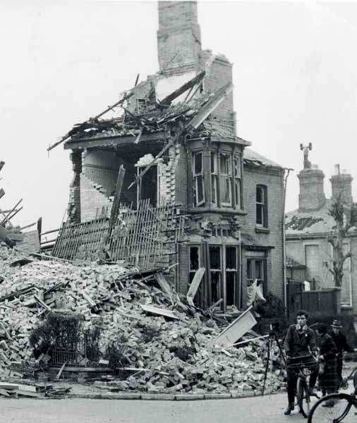 The bombed corner of Sparkenhoe Street. - Austin J. Ruddy