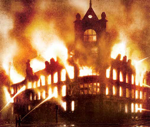 The Freeman, Hardy and Willis building on fire during the Blitz bombing - Austin J. Ruddy