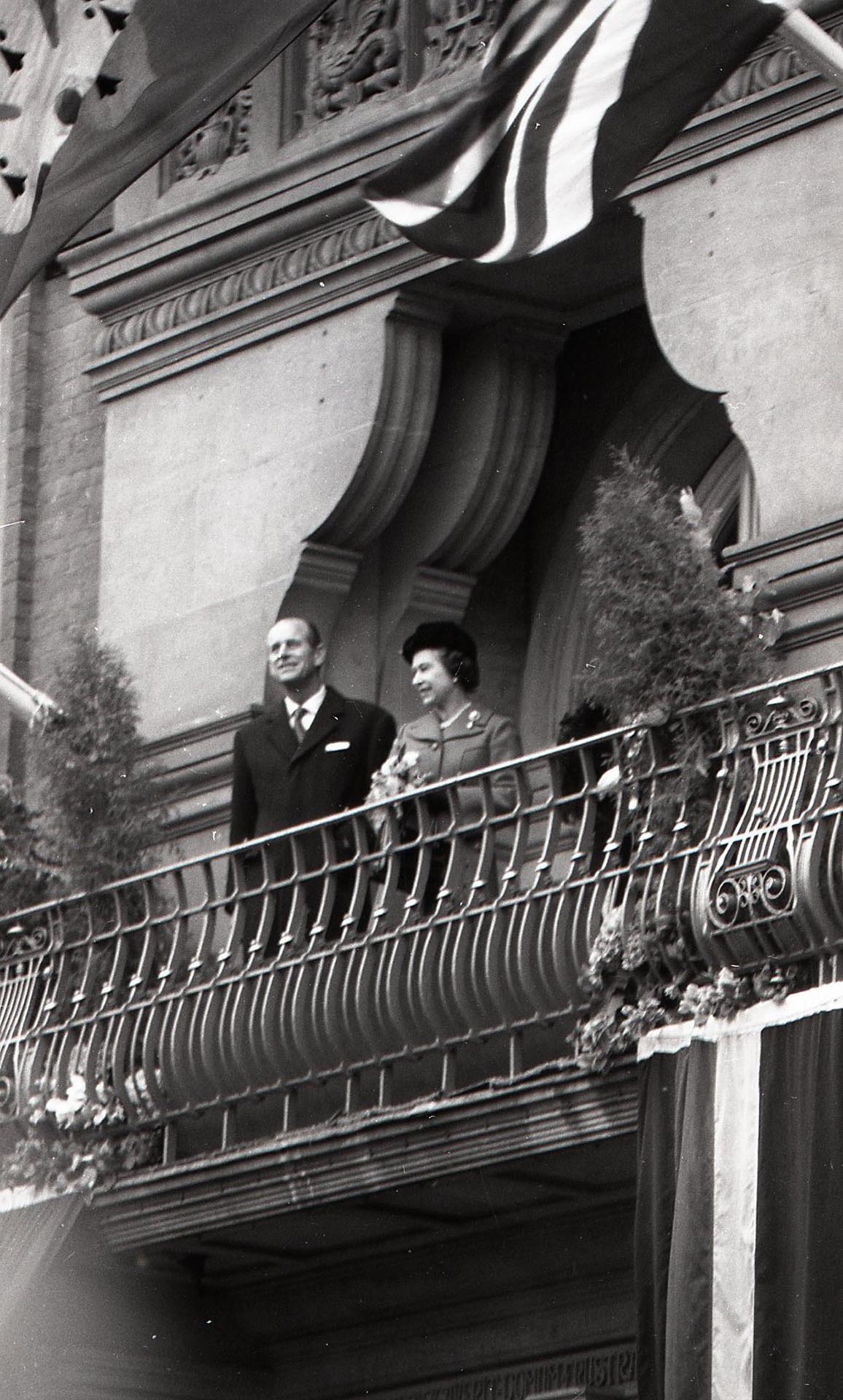 The Queen and Prince Philip stand on a balcony of Leicester’s Town Hall, 1980 - 
