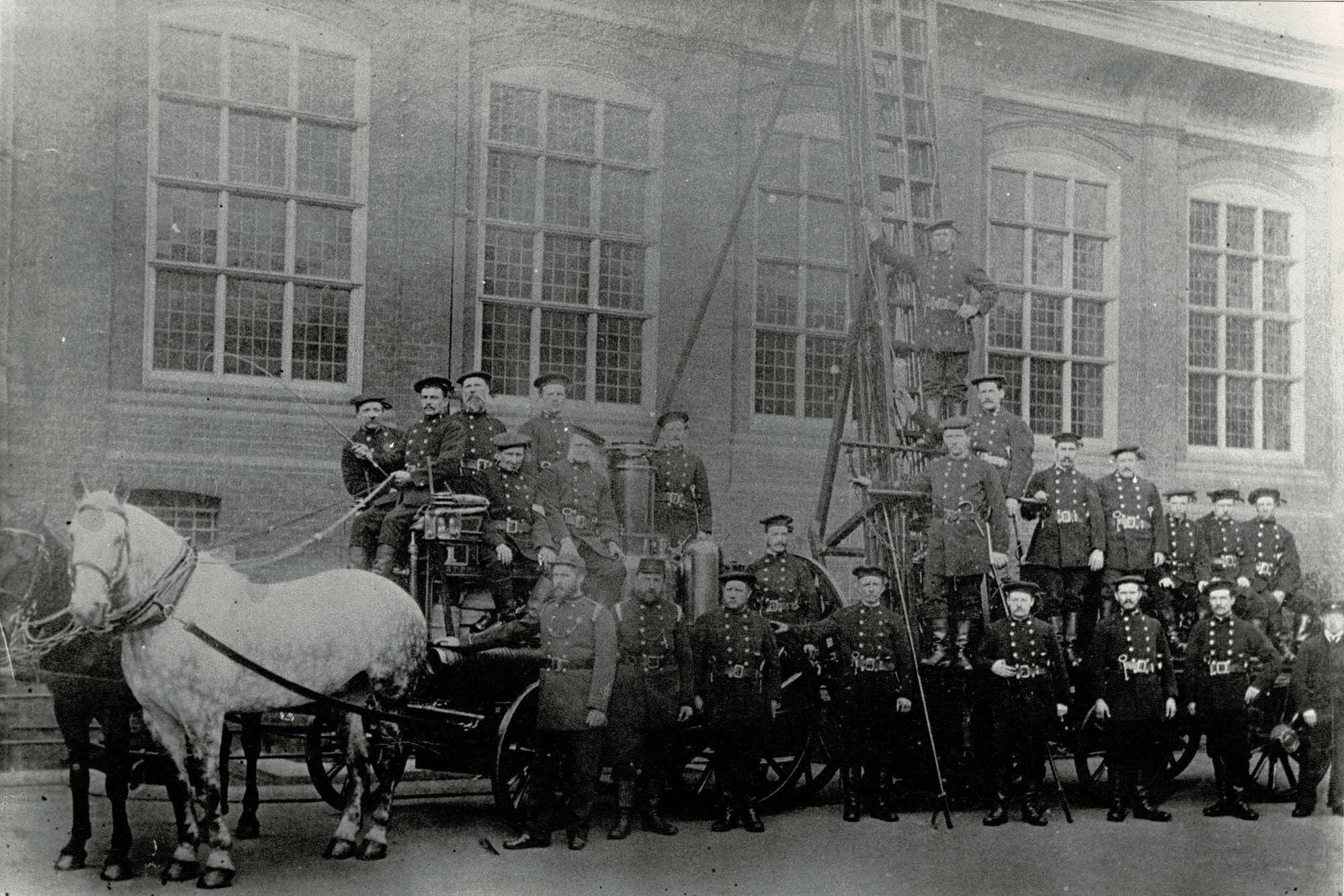 Firemen with a horse-drawn steam fire engine, and a wheeled escape ladder, outside Bowling Green Street Station - Malc Tovey