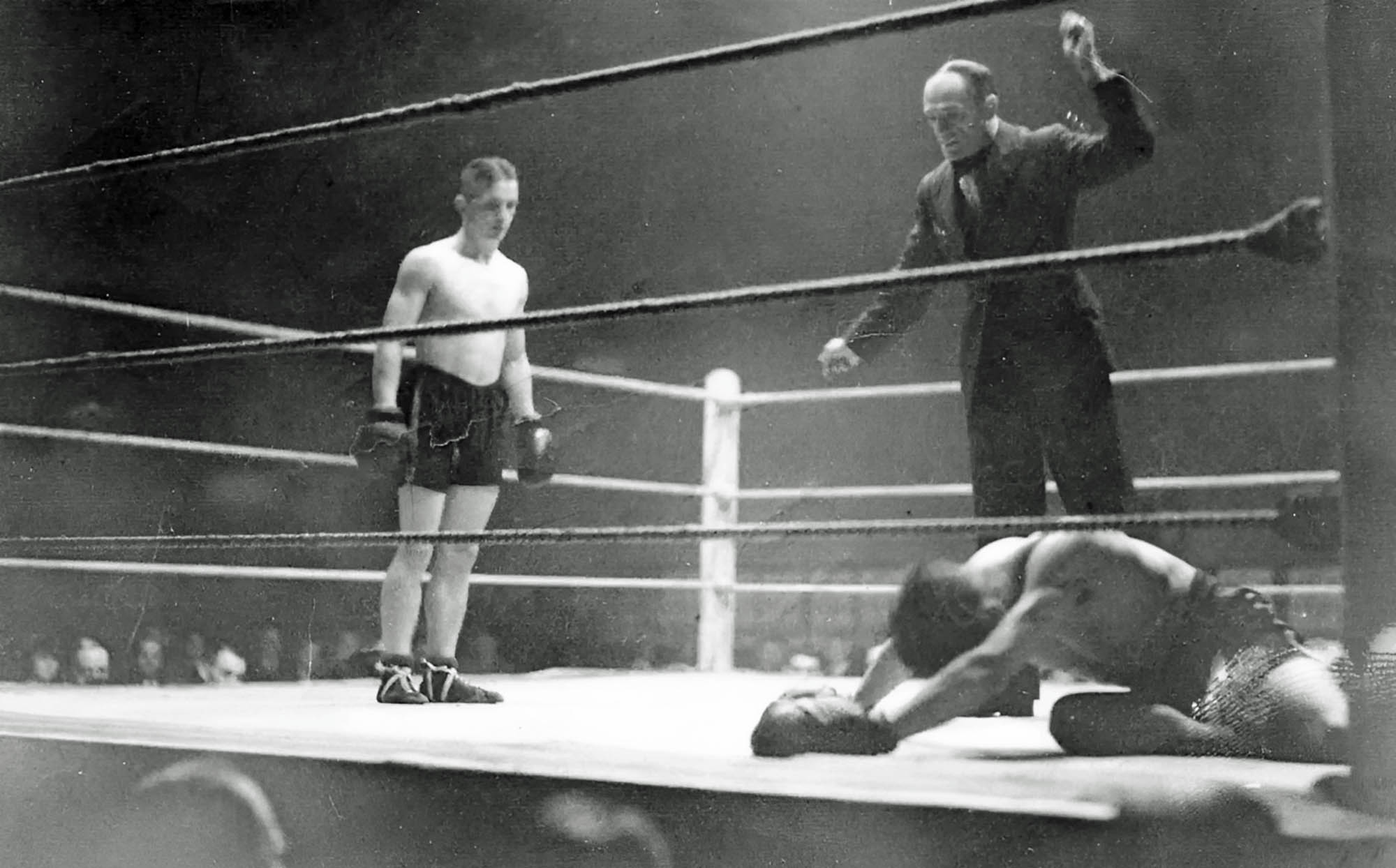 Leicester referee Arthur Morton counts out Charlie Hazell, of Wales, Granby Halls, 1933 -